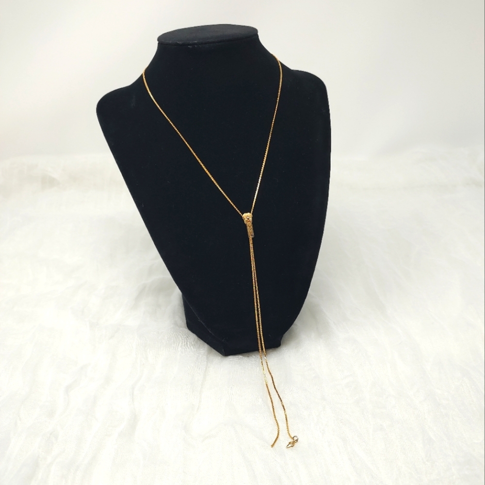 Thin gold color necklace with sliding zipper pendant